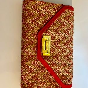 clutch in nature color raffia and red .